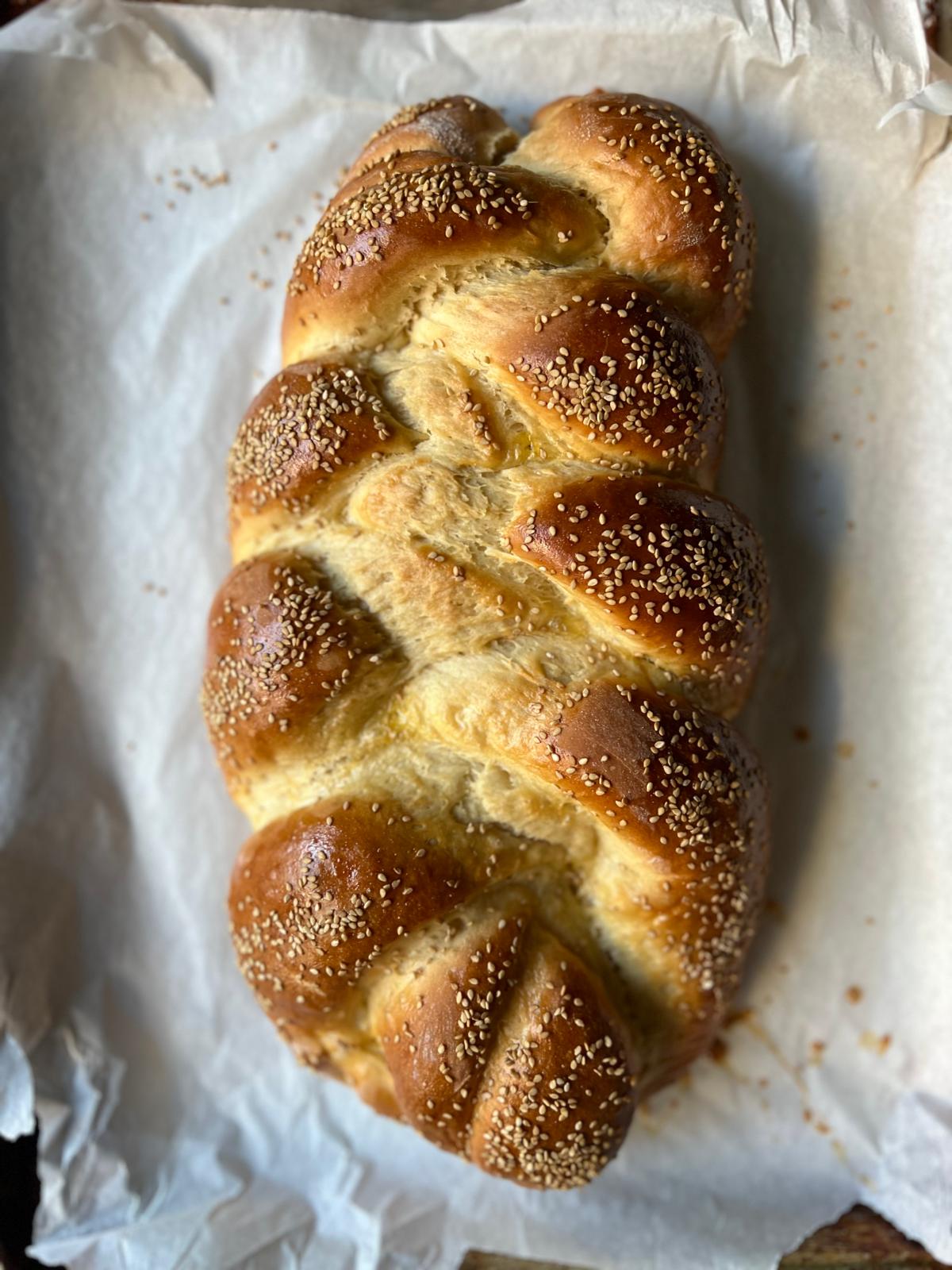 Golden braided challah bread